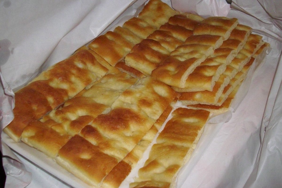 Pieces of focaccia genovese on baking paper
