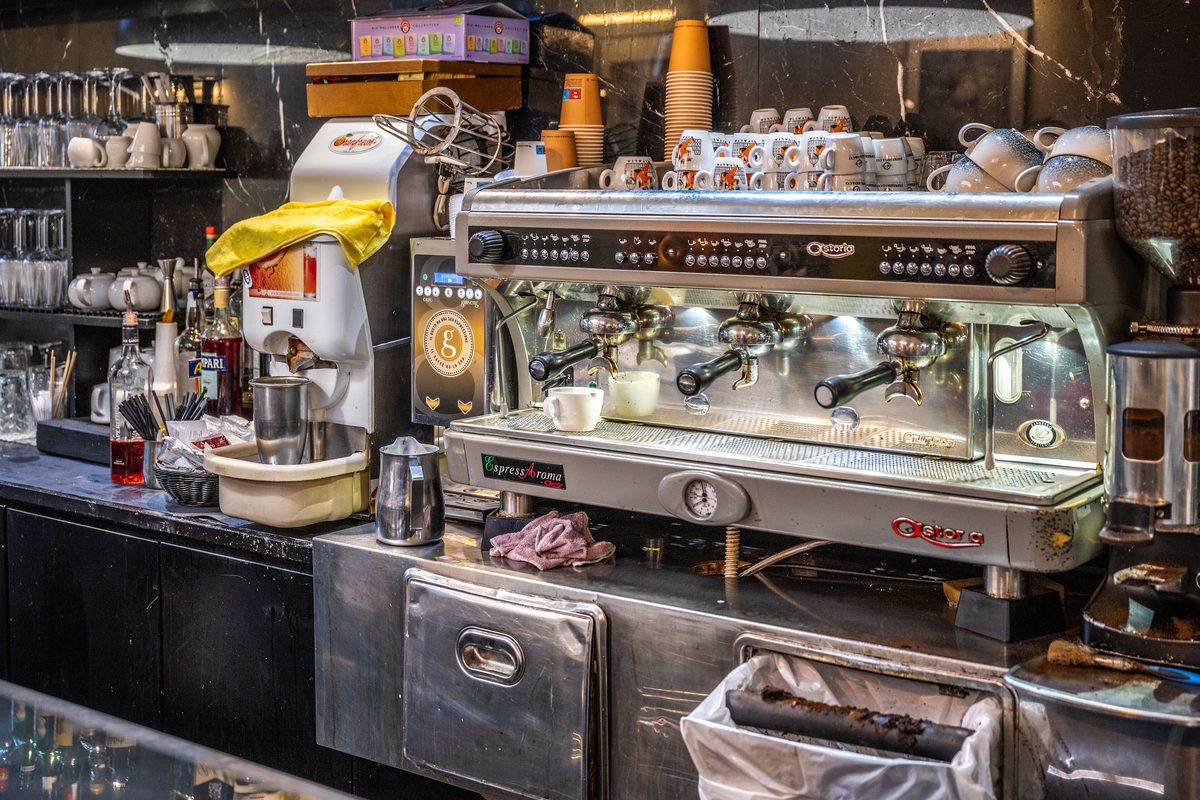 Espresso machine and cups on the counter of a coffee bar in Rome
