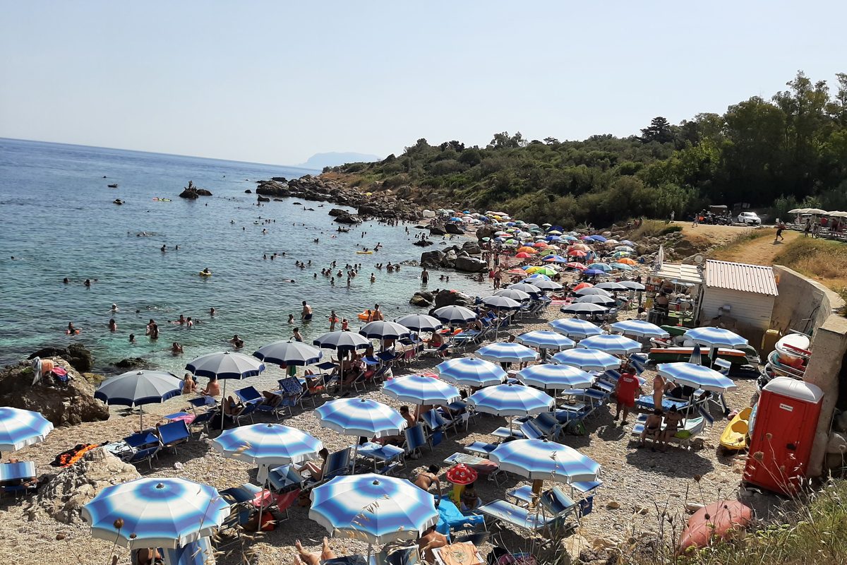 Rows of beach umbrellas on a beach with services in Sciacca, Sicily