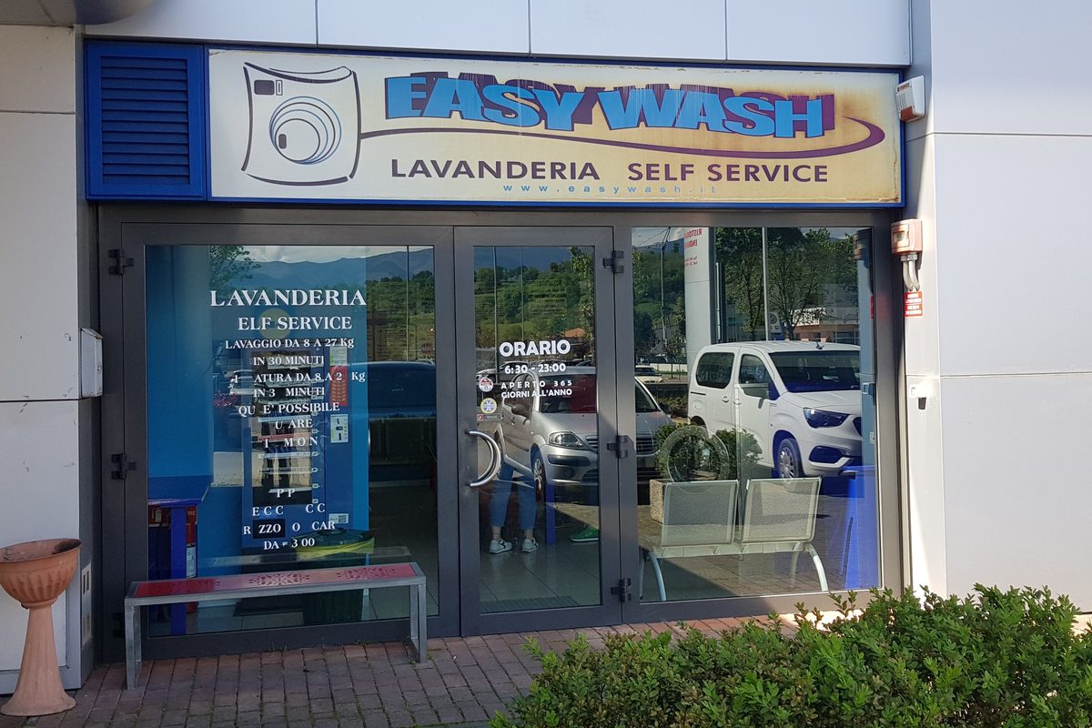 The glass front of the Easy Wash self-service laundrette in San Giovanni Valdarno