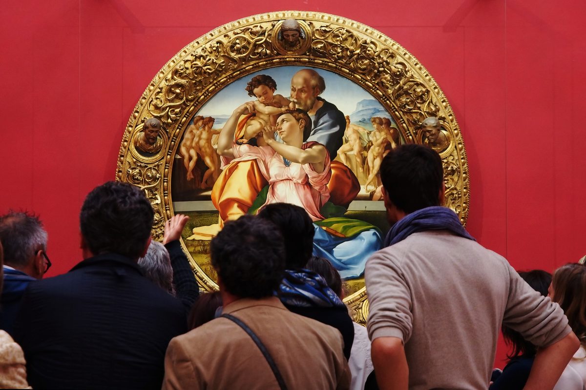 Visitors in front of Michelangelo's Doni Tondo at the Uffizi in Florence