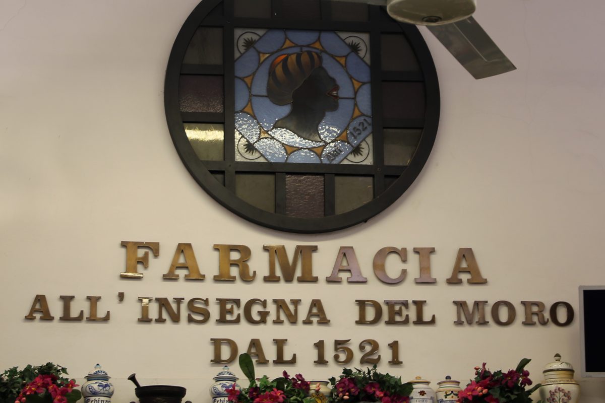 The sign of the Farmacia all'insegna del Moro in Florence, which says it has been there since 1521