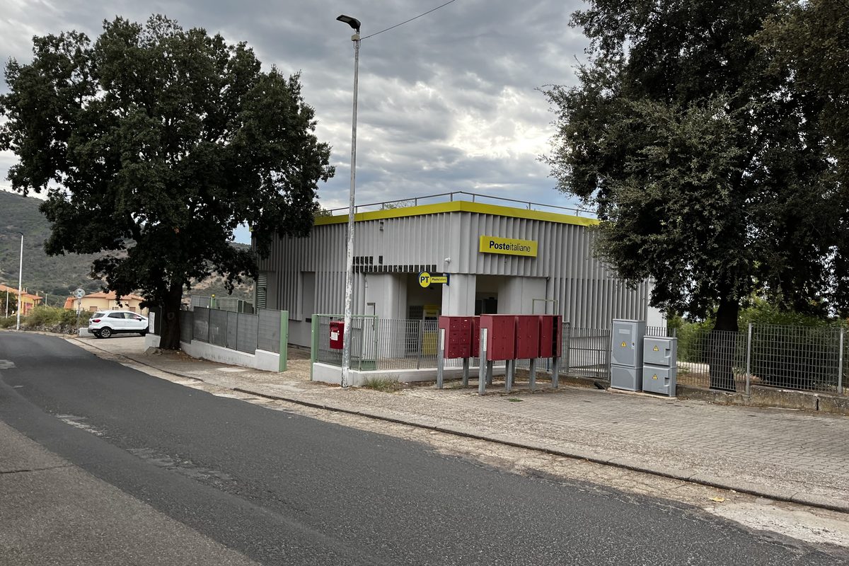 The post office in Cuglieri, Sardinia, with its yellow Poste Italiane sign