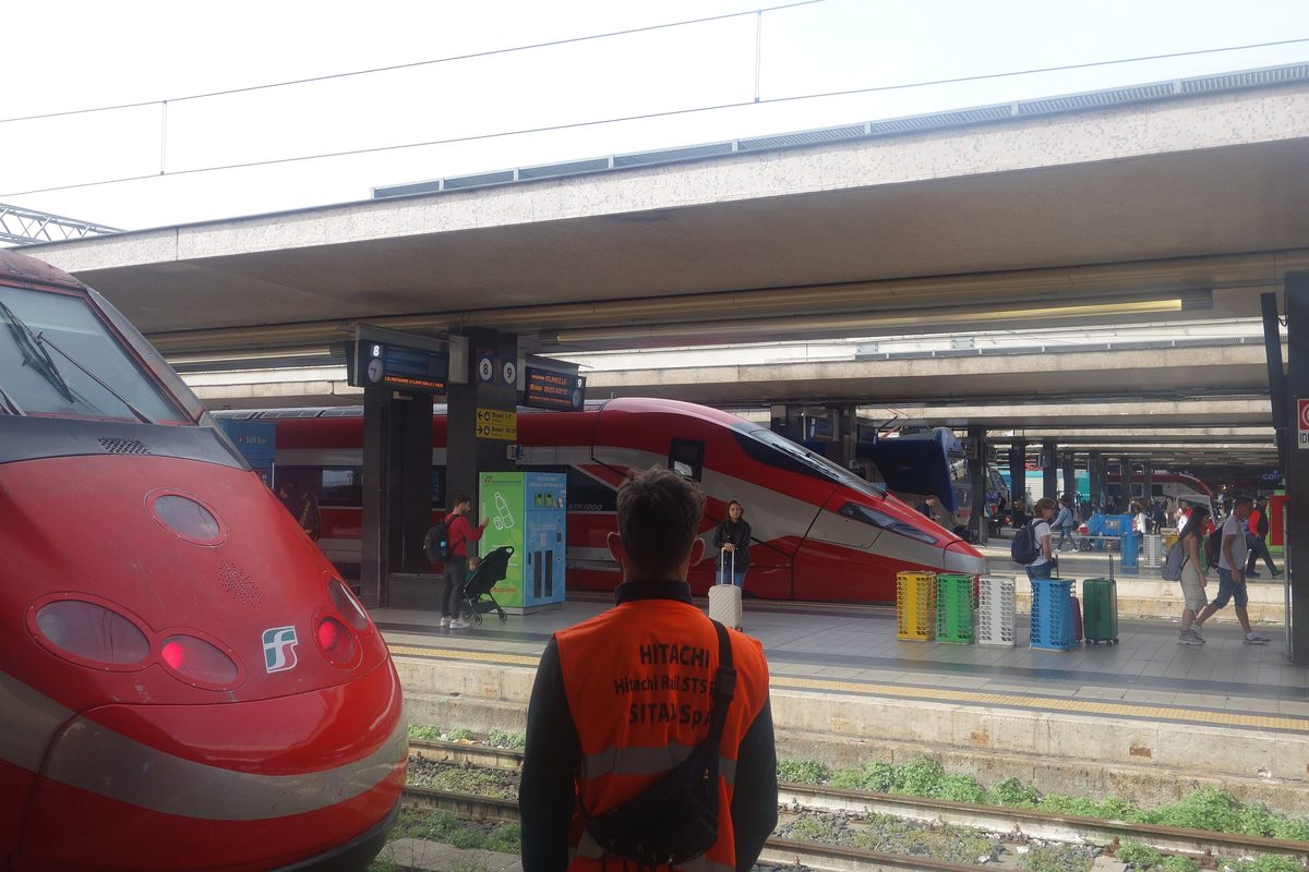 Red high-speed Frecciarossa trains at the platforms of Roma Termini station