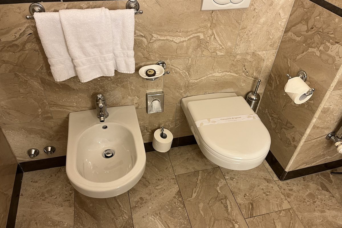 A hotel bathroom in Trieste with a bidet next to the toilet