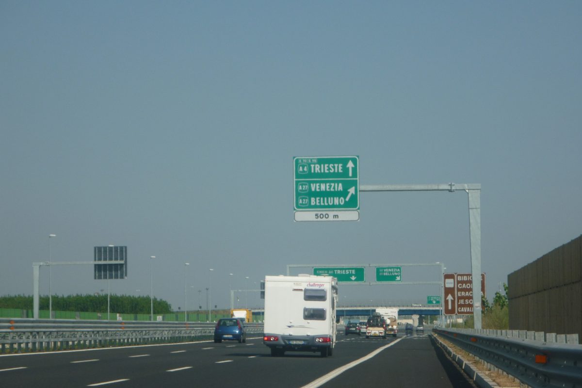 Motorway signs on the A4 near Mestre pointing to Trieste, Venezia and Belluno