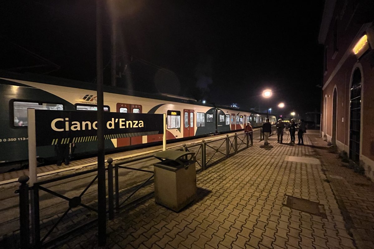 A regional train waiting at the small station of Ciano d'Enza at night