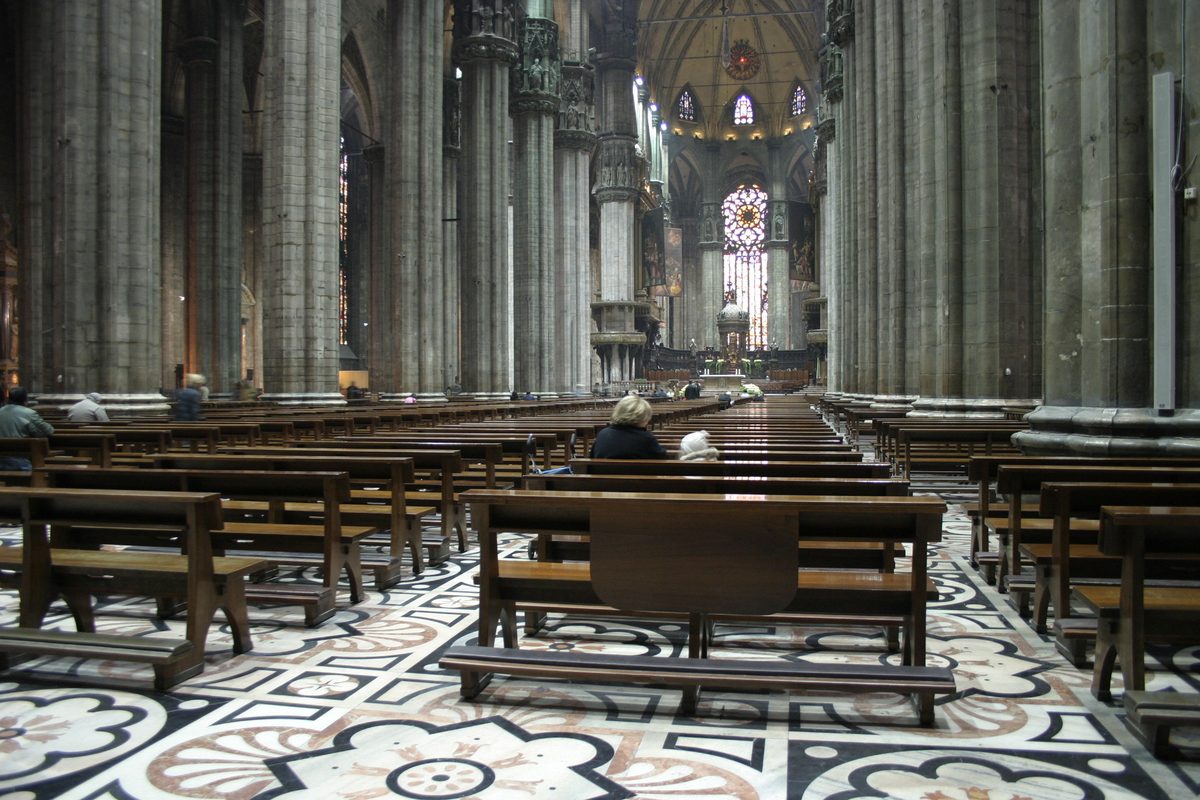 The nave and pews inside Milan cathedral